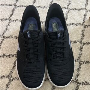 Skechers women’s Black Lace-Up Slip-On Sneakers with White Accents
